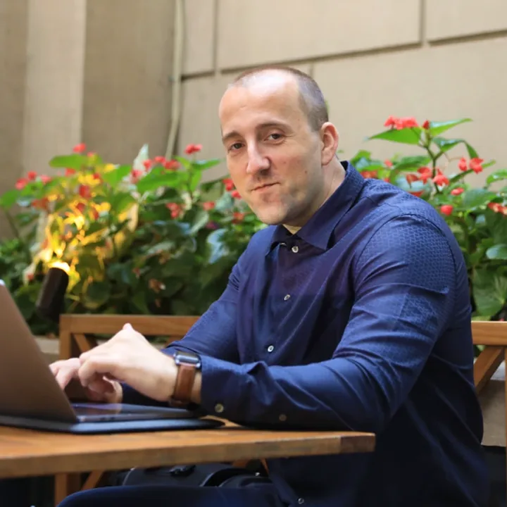 Brian Dordevic working on a laptop